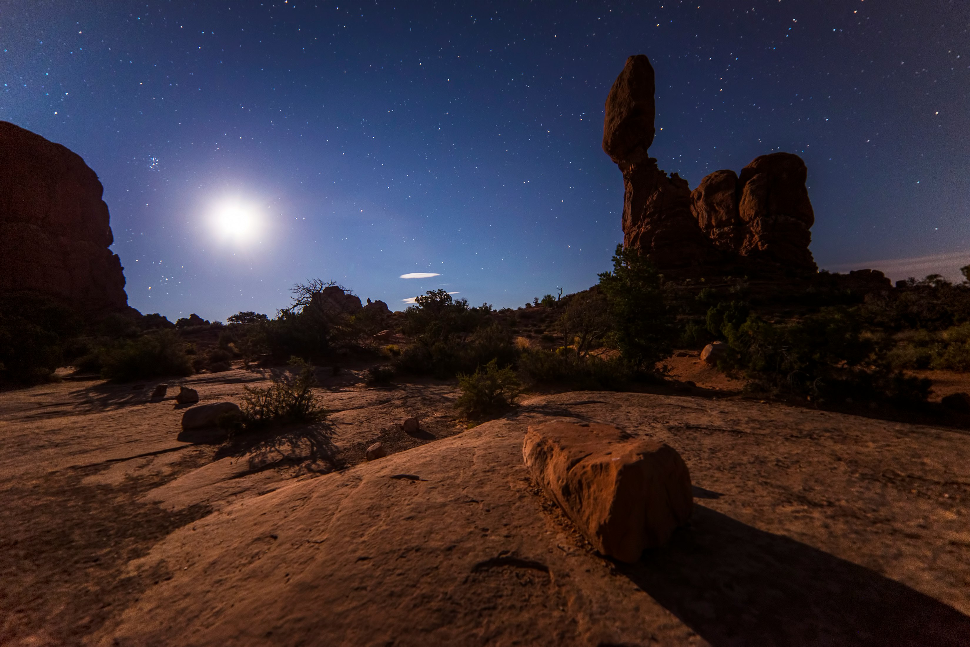 rock formation under starry skies